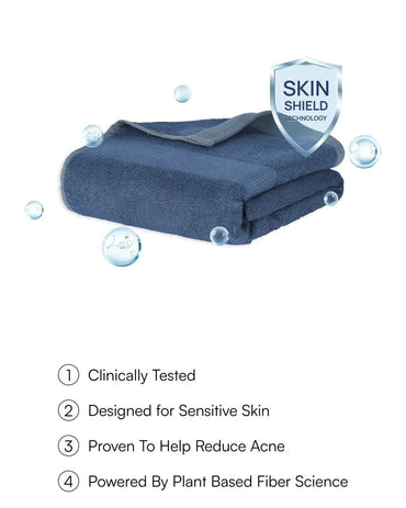 Blue towel with 'Skin Shield' technology label on a white background