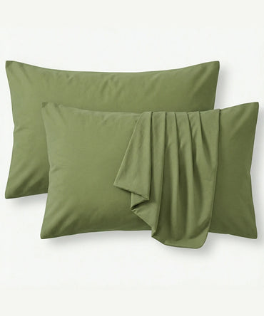 Two aloe green pillowcases on a white background