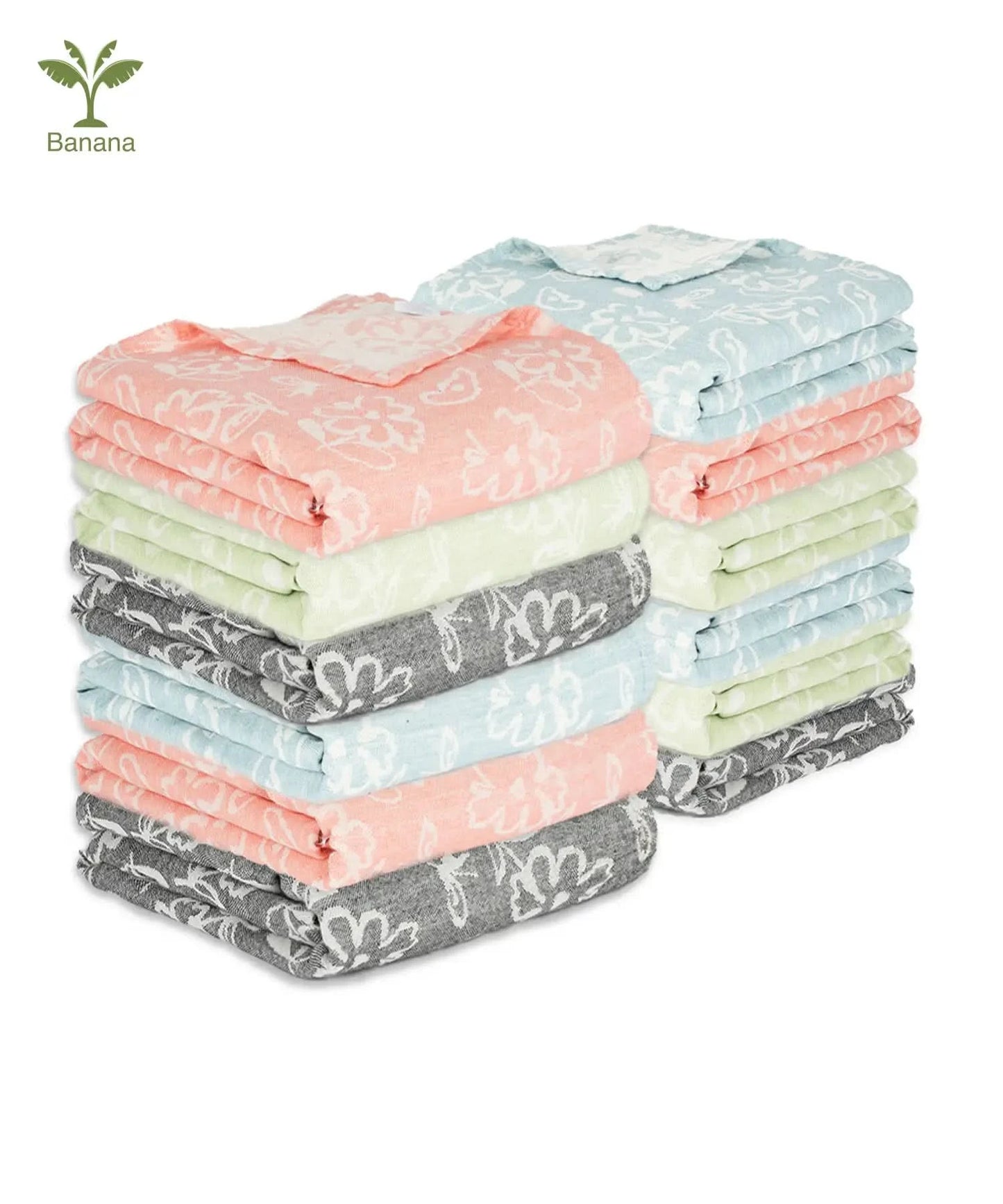 Stack of folded Banana Jacquard Floral Towel with various patterns on a white background.