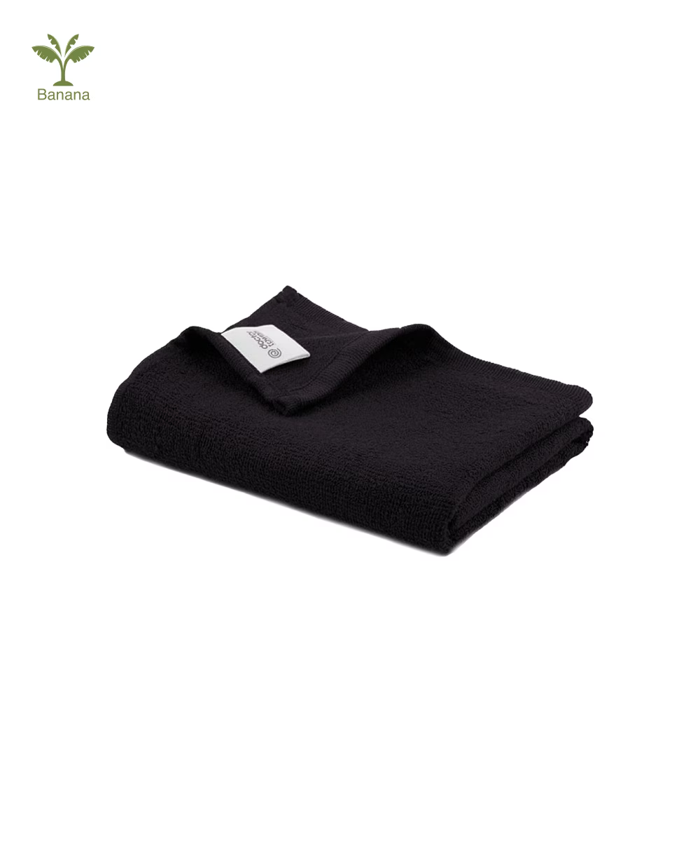 Folded Banana terry gym towel - jet black color with a visible banana icon on a white background