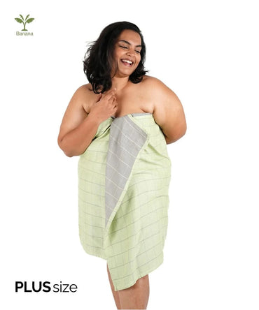 Woman wrapped in a candy green towel with 'Banana' logo, featuring 'Plus size' text.