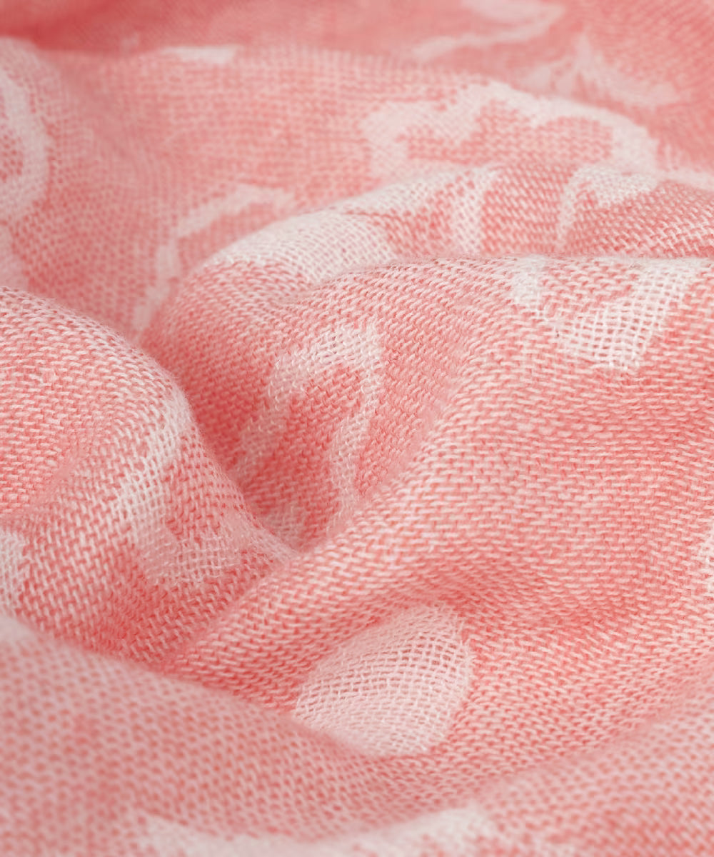 Close-up of pink fabric with a subtle pattern