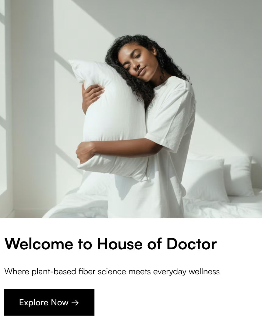 Woman holding a pillow in a bright room with 'House of Doctor' branding.
