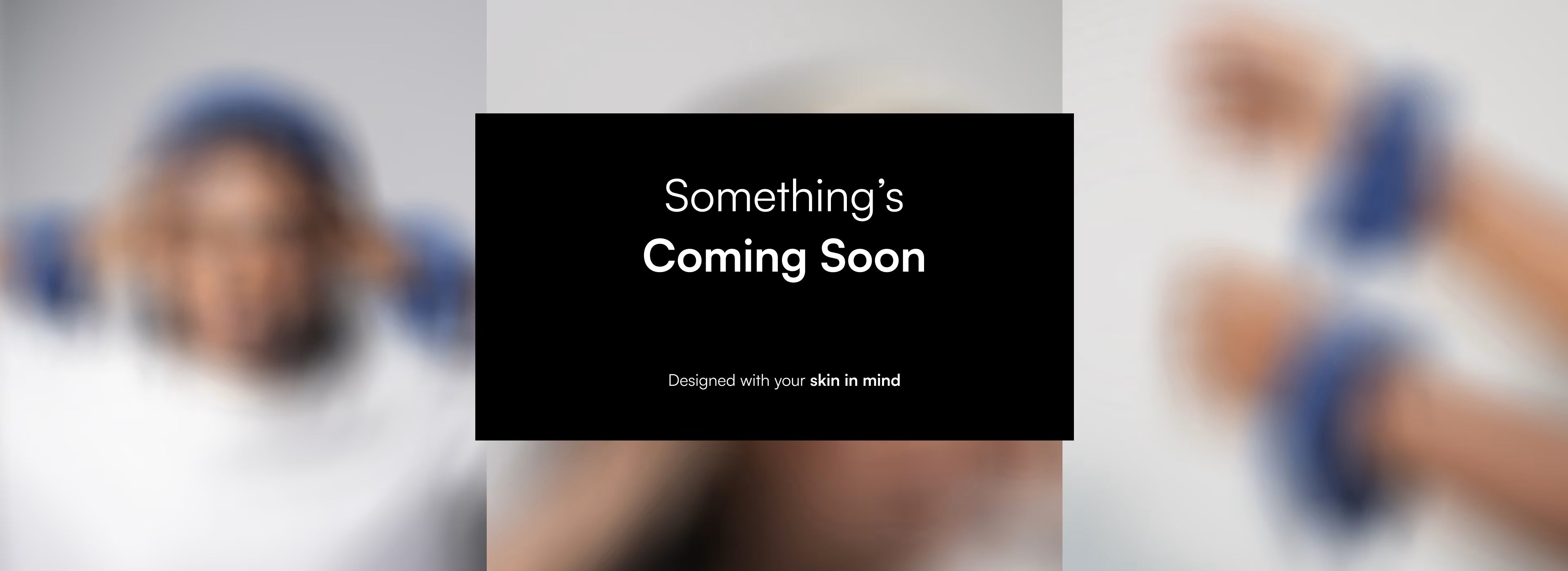Placeholder image with 'Something's Coming Soon' text on a black bar, blurred faces in the background.
