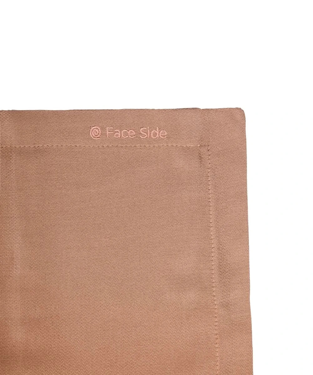 Close-up of a brown fabric with 'Face Side' text on a white background