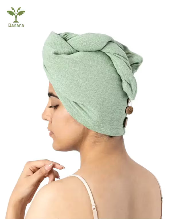 Woman wearing a candy towel wrap on a white background with 'Banana' logo.