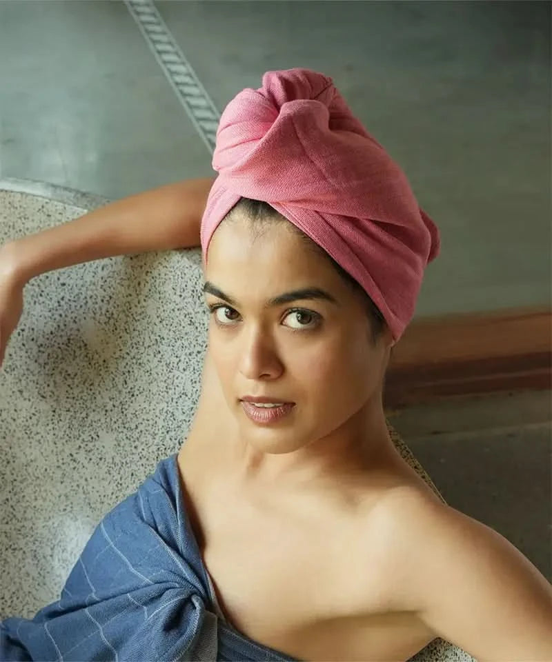 Woman with a Banana double cloth hair towel wrapped around her head in a bathroom setting