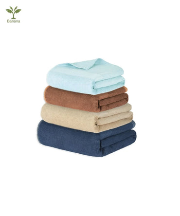 Stack of folded towels in blue, brown, beige, and navy on a white background with Banana Brand icon.