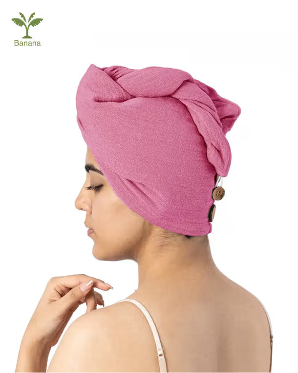 Woman wearing a desert rose - banana double cloth hair towel on a white background