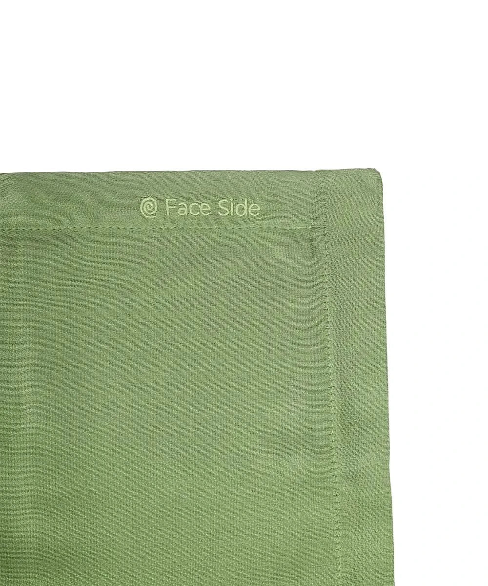 Close-up of aloe green pillowcase with 'Face Side' text on a white background