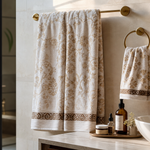 Elegant patterned towels in a stylish Indian bathroom with a smaller separate face towel near the sink