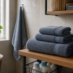 Organized towel set with bath towel, face towel, and hand towel in a compact bathroom