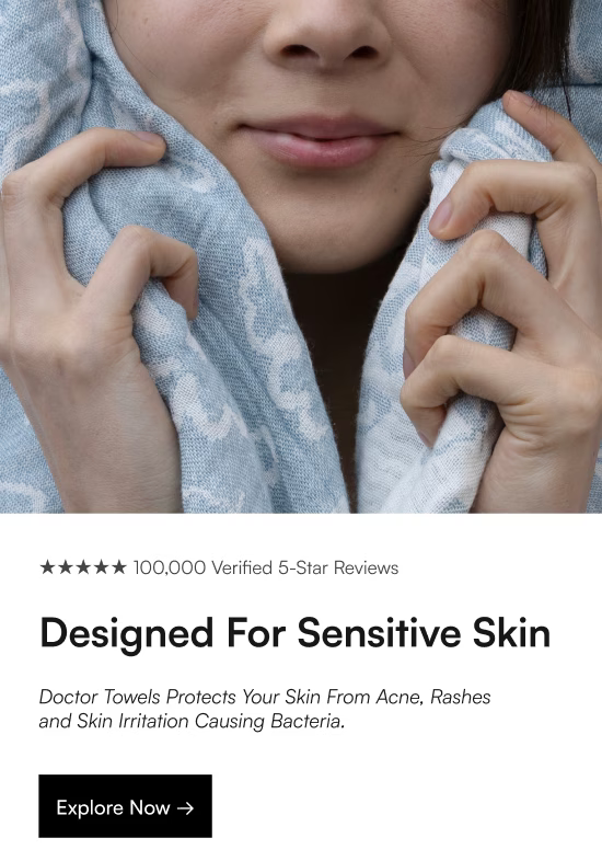 Person holding a blue patterned towel with promotional text about sensitive skin care.