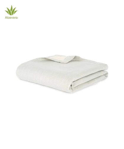 Folded frosted grey Aluvera towel on a white background with a small Aloe Vera tag.