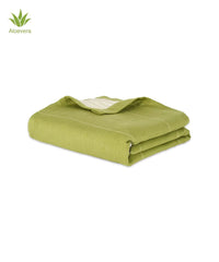 Folded green aluvera towel with Aloevera logo on a white background