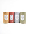 Four Aloe vera product containers in different colors on a white background