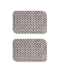 Two arrow printed bath mats on a white background