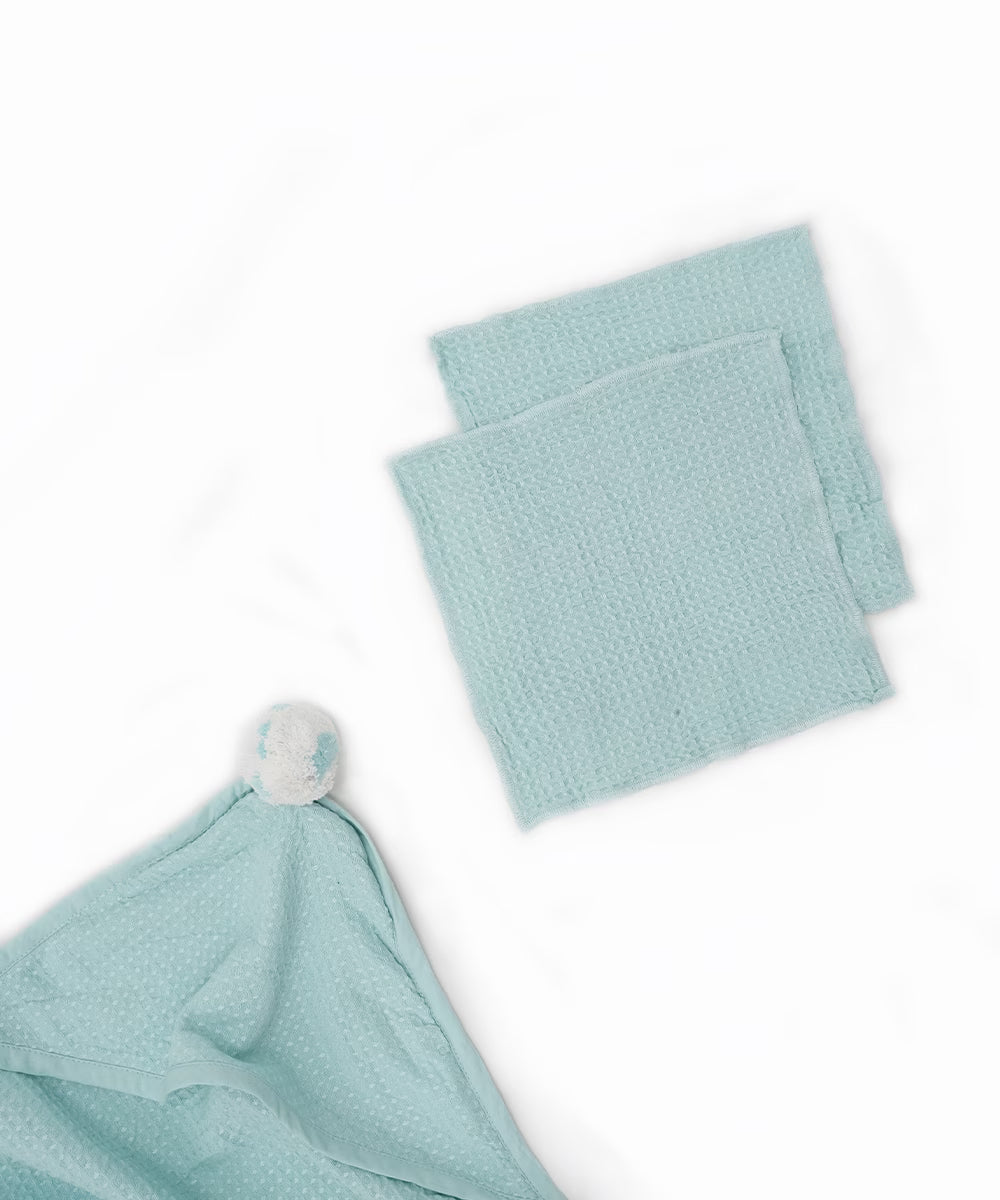 Light blue baby towel and towel set on a white background