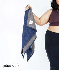 Person holding a Doctor Towels with 'plus size' text on a white background