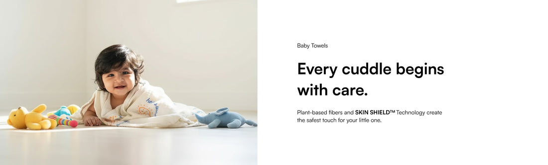 Child lying on a white floor with toys, accompanied by text about baby towels and care.