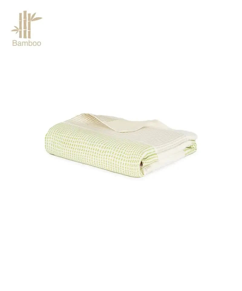 Folded light green checkered towel on a white background with 'Bamboo' branding.