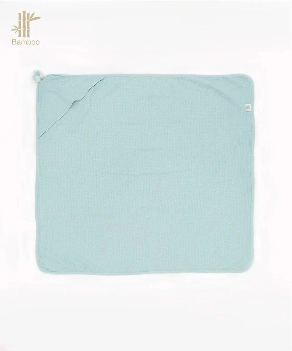 Light blue hooded baby towel on a white background, featuring the Bamboo logo.
