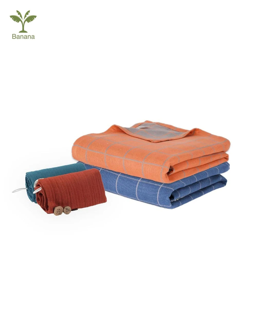 Three folded towels in orange, blue, and red on a white background.
