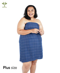 Woman wearing a Banana Double Cloth bath towel on a white background with 'Banana' logo.