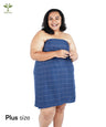 Woman wearing a Banana Double Cloth bath towel on a white background with 'Banana' logo.