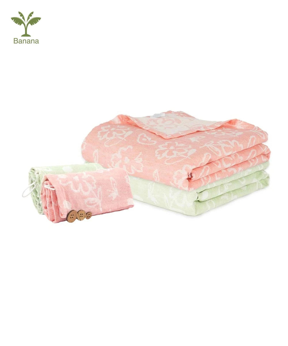 Set of pink and green patterned cloths on a white background with Banana brand logo.