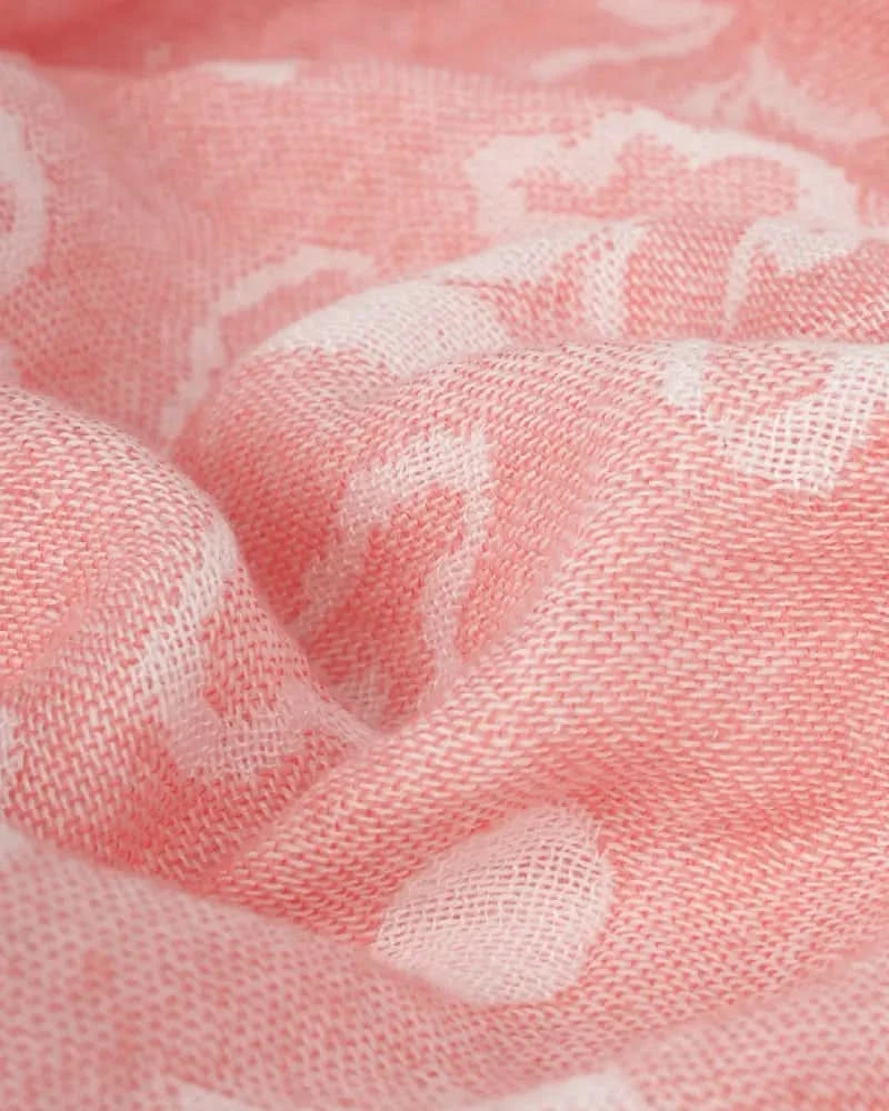 Close-up of coral towel with floral pattern