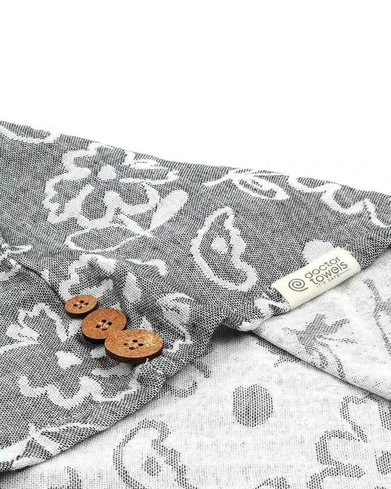 Banana floral hair towel - charcoal grey  with white patterns and buttons on a white background