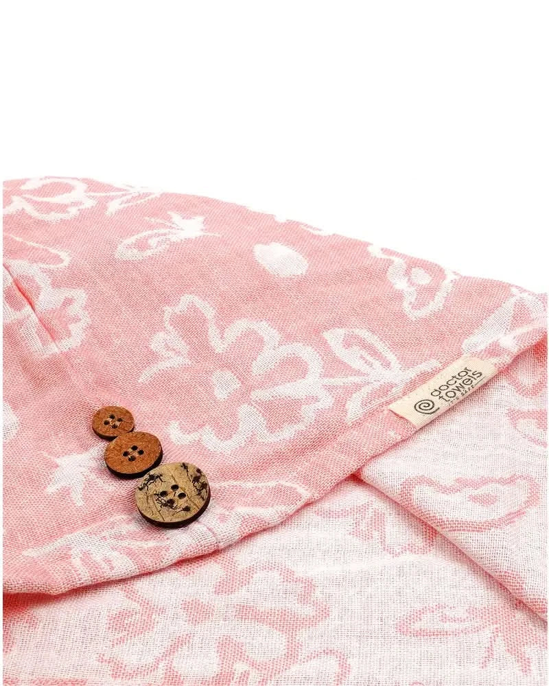 Banana floral towel and wooden buttons on a white background