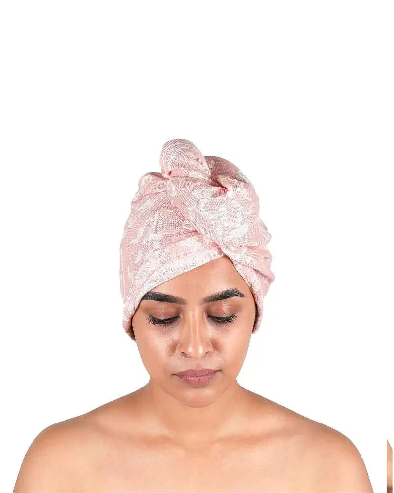 Woman wearing a Banana floral hair towel on a white background