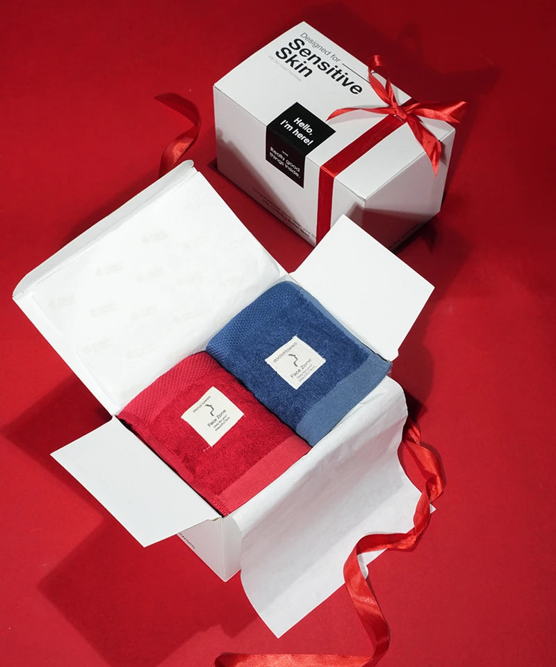 Red and blue products in an open box with a white box labeled 'sensitive skin' on a red background.