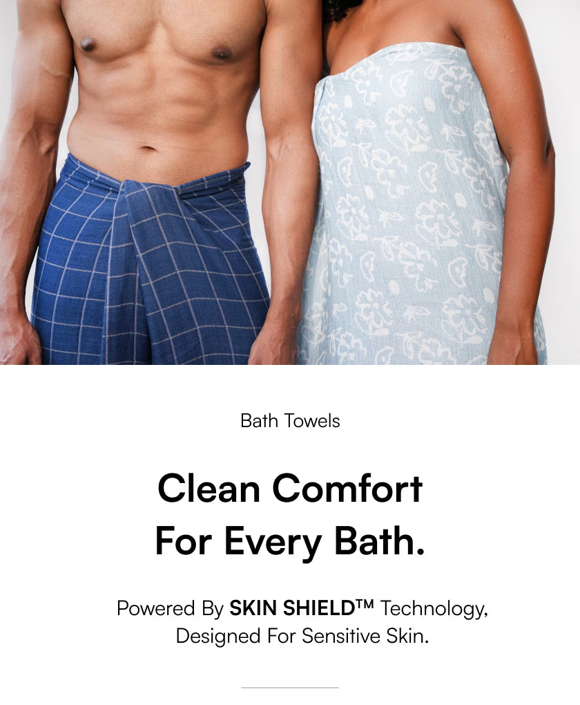 Two people wearing bath towels with text about skin shield technology.