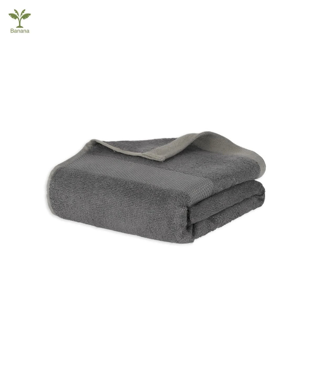 Folded Shadow grey blanket on a white background