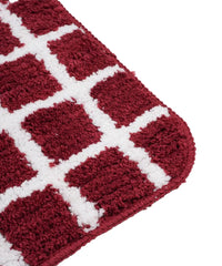 Red and white checkered bath mat on a white background - closeup shot