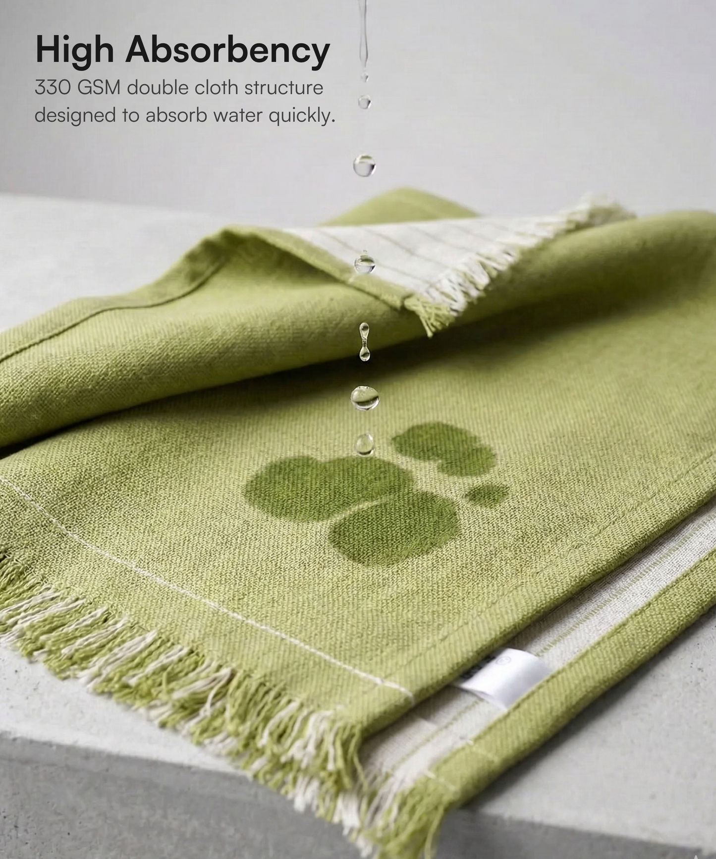Water droplets falling onto a aloe vera towel - aloe green Doctor Towels face towel demonstrating high absorbency.