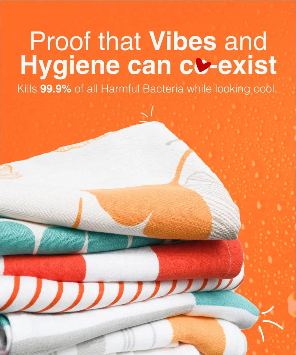 Stack of colorful towels with text on an orange background