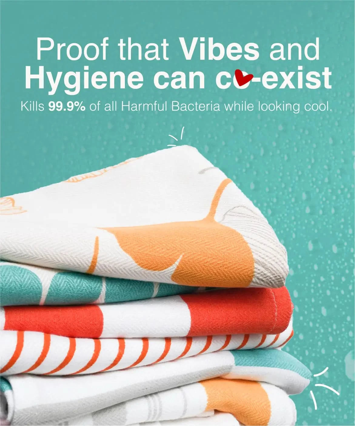 Stack of colorful towels with text about hygiene and bacteria-killing properties on a teal background