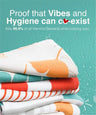 Stack of colorful towels with text about hygiene and bacteria-killing properties on a teal background