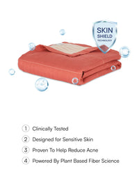 Red (Apricot Brandy ) Towel with 'Skin Shield' technology label on a white background