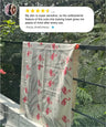 Towel with flamingo pattern hanging on a rack with a review above it.