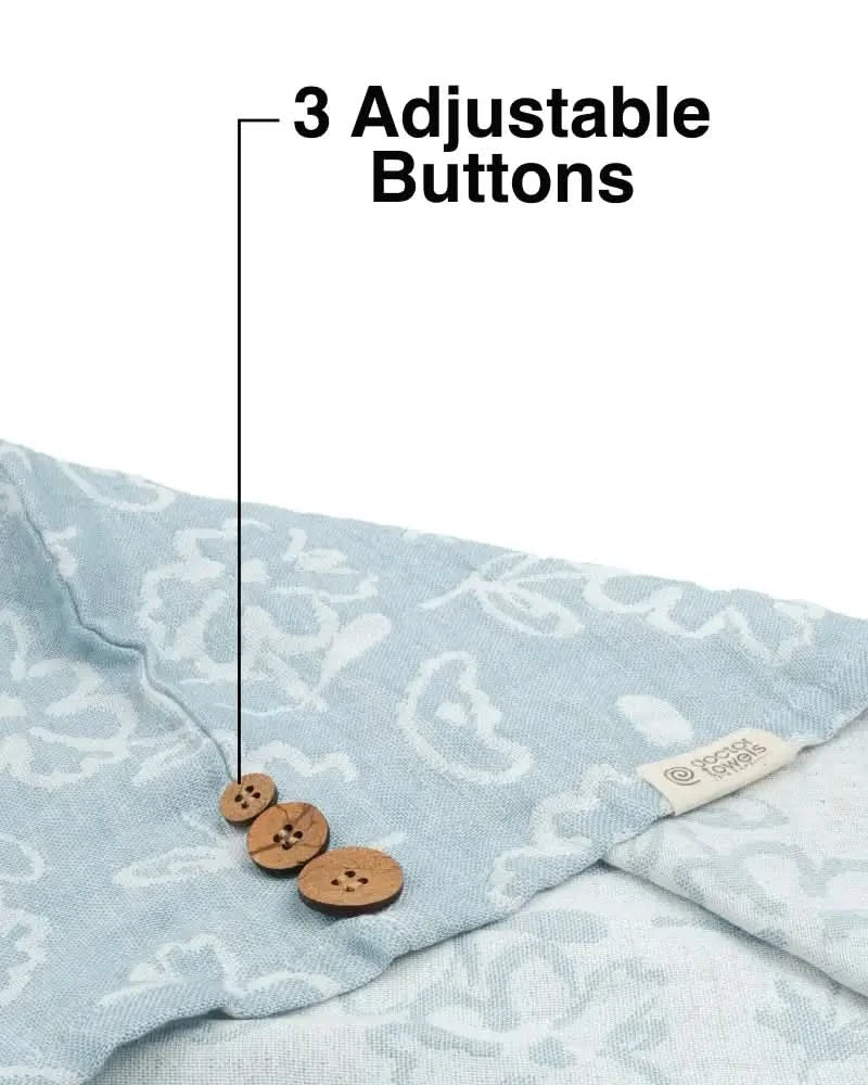 Banana jacquard floral hair towel - chalk blue color with three wooden buttons on a white background