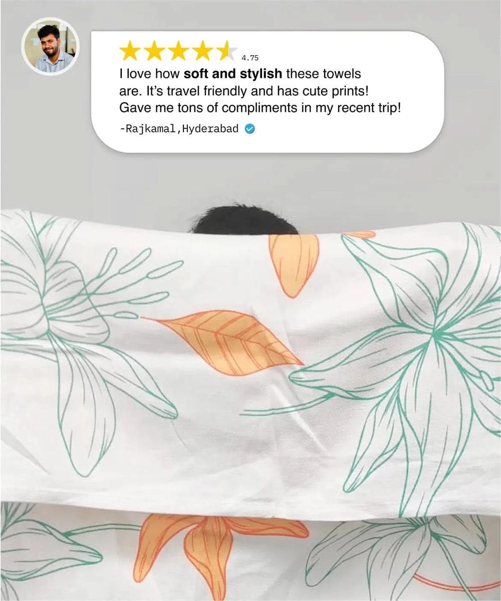 Person holding a sunlit bloom towel with a review above it.