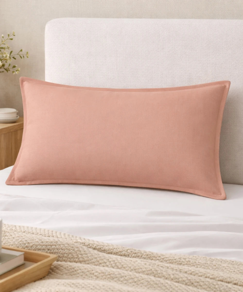 Pillowcase Pack of 2  - peach colored pillow on a bed with a neutral headboard