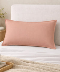 Pillowcase Pack of 2  - peach colored pillow on a bed with a neutral headboard