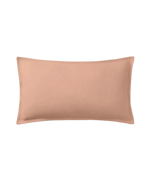 Honey peach pillow on a white background