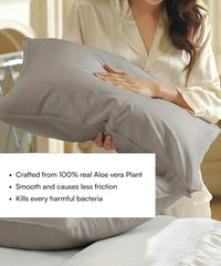 Person holding a pillow with Aloe vera plant properties highlighted